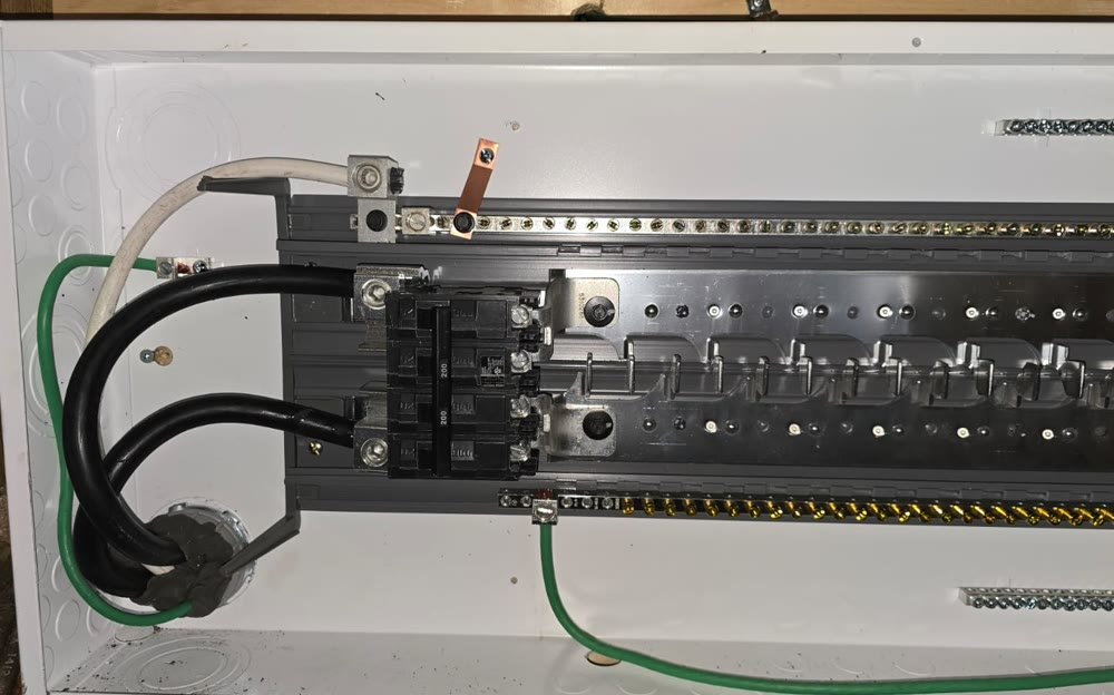 Main breaker and bus bars inside a residential electrical panel